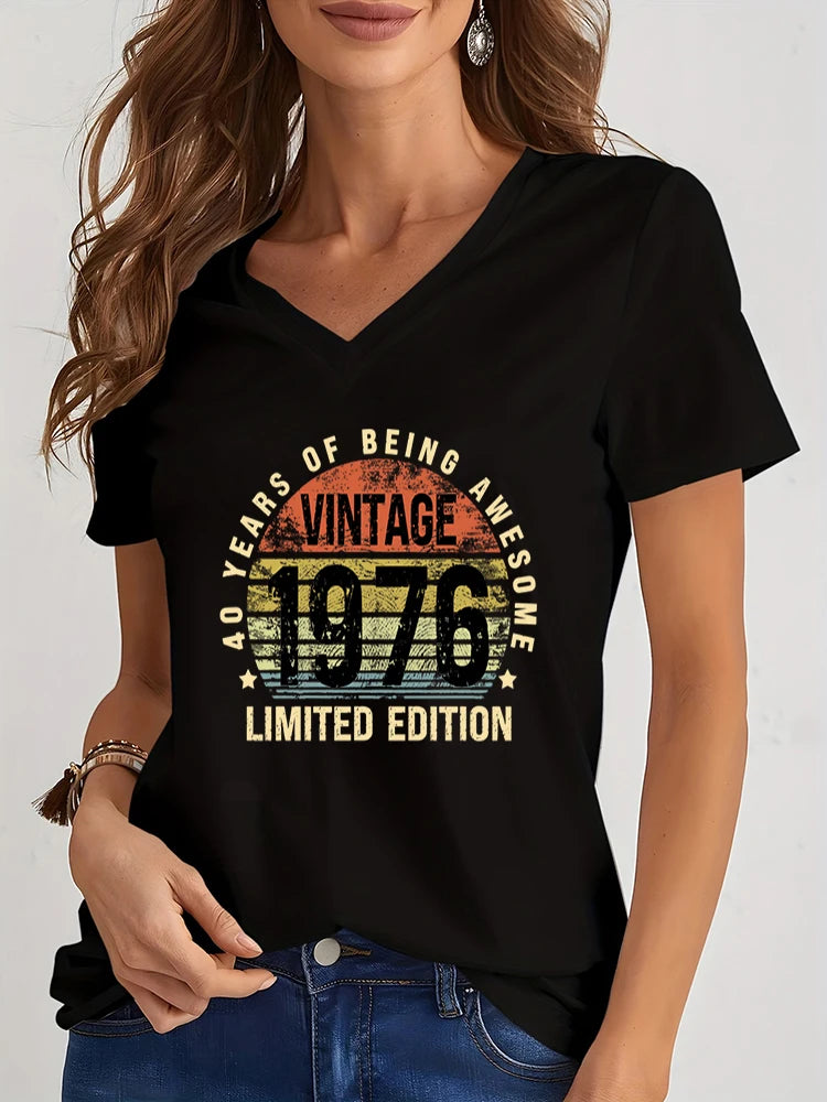 Woman wearing a black t-shirt with 'Vintage 1976' design on a white background