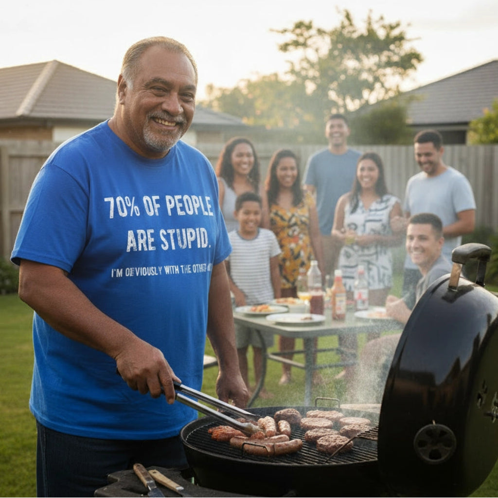 Man grilling outdoors with a group of people in the background