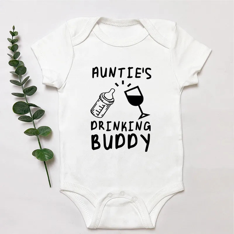 White baby onesie with 'Auntie's Drinking Buddy' text and graphics on a light gray background.