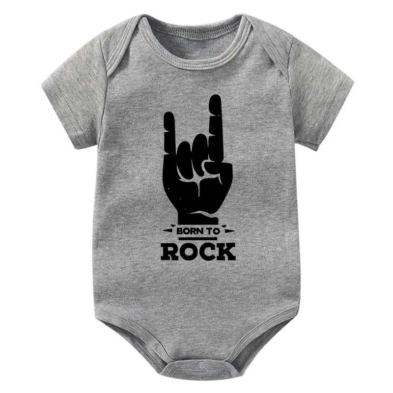 Grey baby onesie with a black hand sign and 'Born to Rock' text on a white background