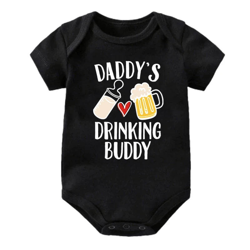 Black baby onesie with 'Daddy's Drinking Buddy' text and graphics on a white background
