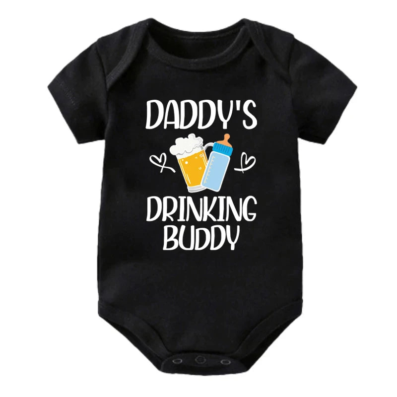 Black baby onesie with 'Daddy's Drinking Buddy' text and graphics on a white background