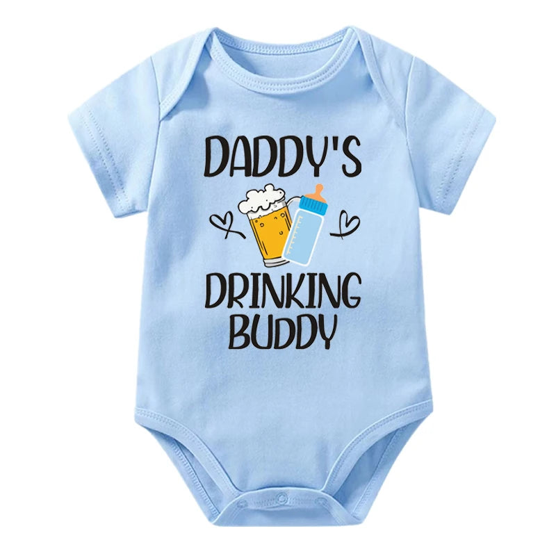 Light blue baby onesie with 'Daddy's Drinking Buddy' text and graphics on a white background