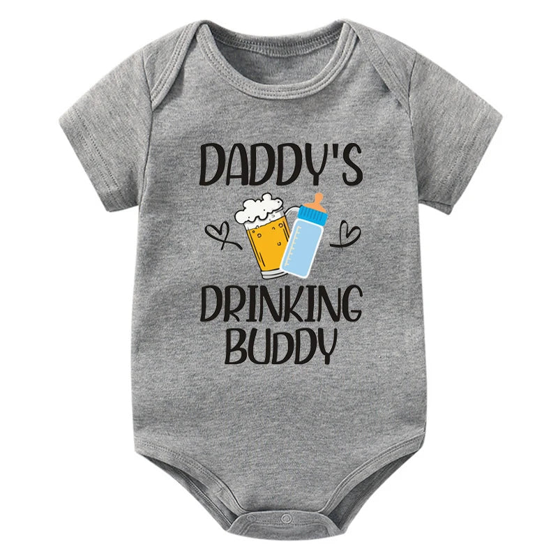 Gray baby onesie with 'Daddy's Drinking Buddy' text and graphics on a white background