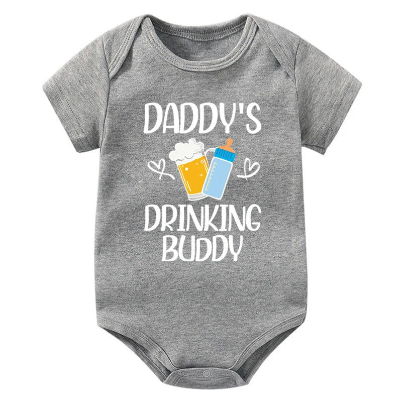 Gray baby onesie with 'Daddy's Drinking Buddy' text and graphics on a white background