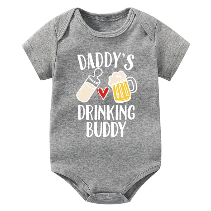 Gray baby onesie with 'Daddy's Drinking Buddy' text and graphics on a white background