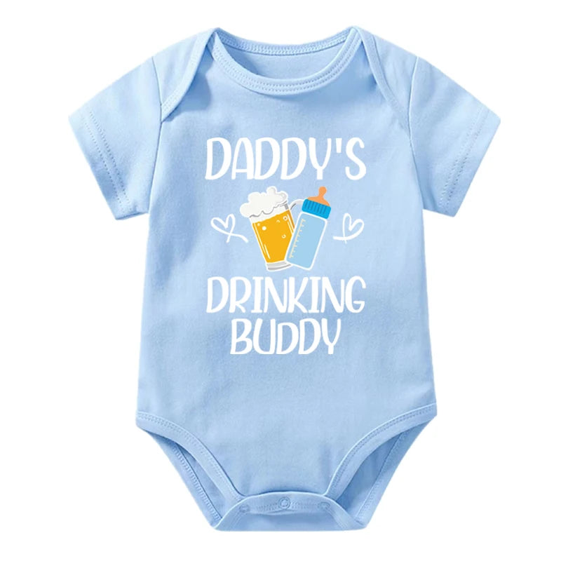 Light blue baby onesie with 'Daddy's Drinking Buddy' text and graphics on a white background