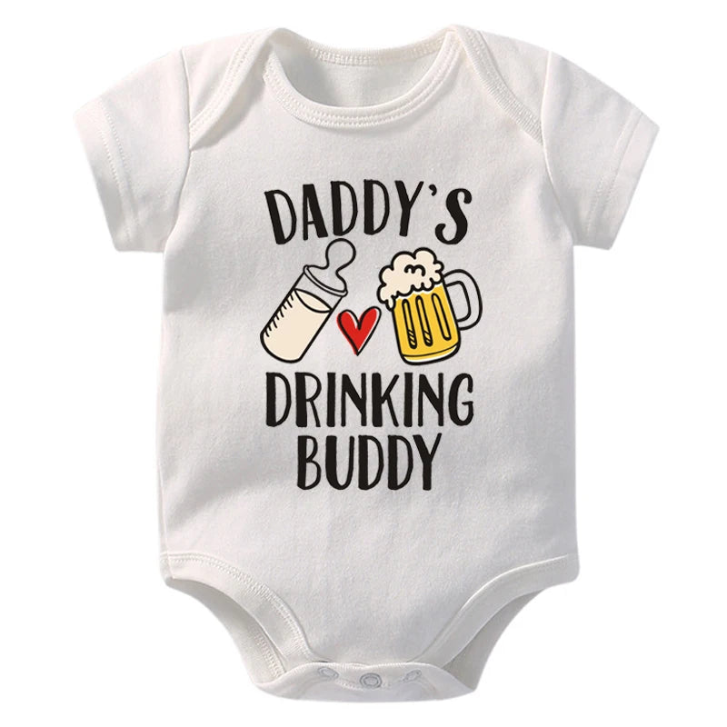White baby onesie with 'Daddy's Drinking Buddy' text and graphics on a white background