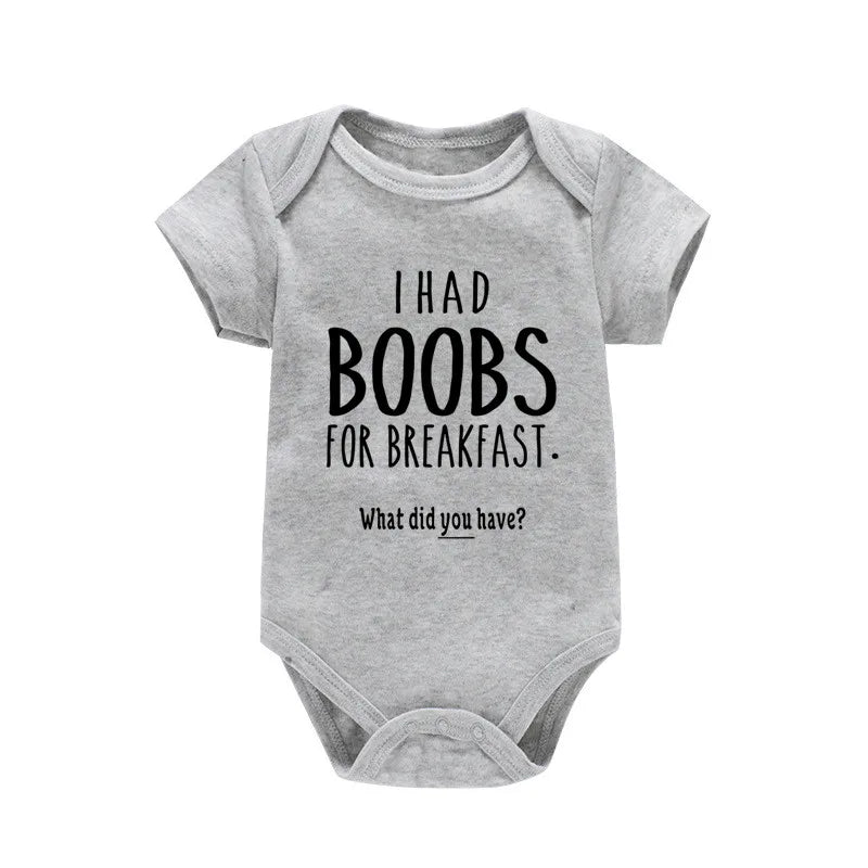Gray baby onesie with humorous text on a white background