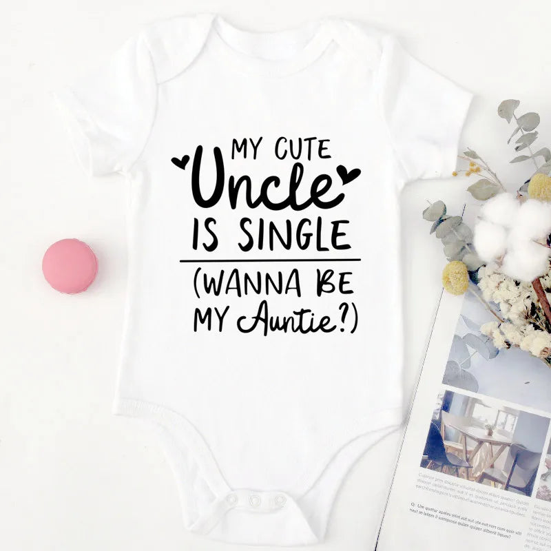 White baby onesie with text 'My cute uncle is single (wanna be my auntie)?' on a white background.