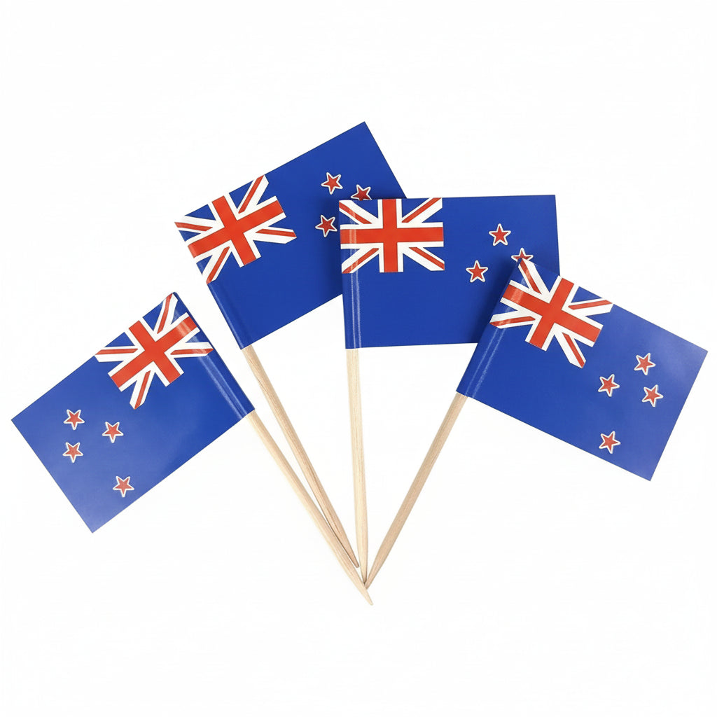 Four New Zealand flags on toothpicks against a white background