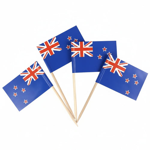 Four New Zealand flags on toothpicks against a white background