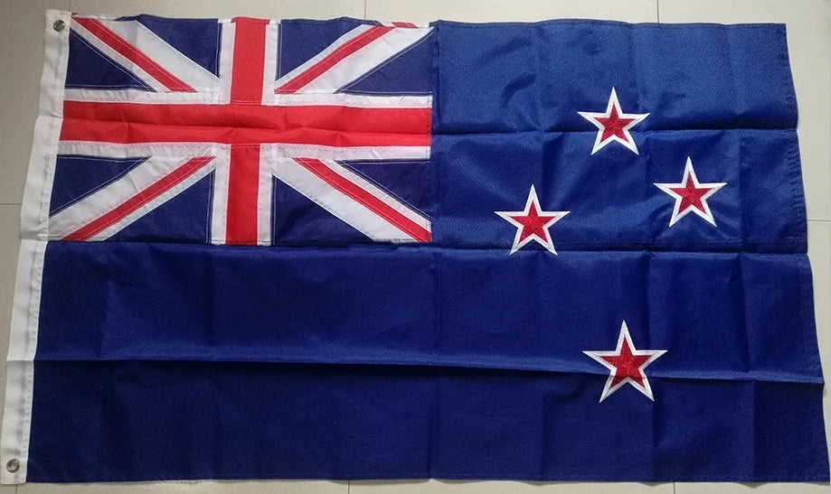 Flag with a blue background, red crosses, and white stars on a tiled wall.