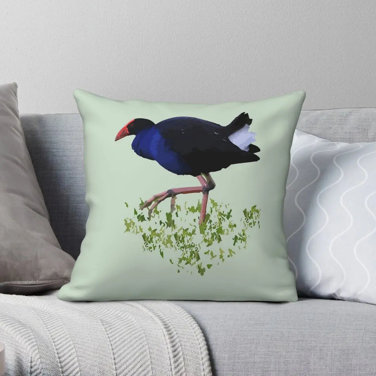 Pillow with a bird design on a couch