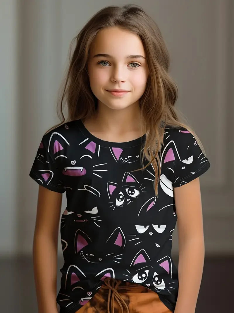Young girl wearing a black t-shirt with cat patterns against a neutral background
