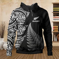 Black hoodie with white fern design and 'Rugby' text, displayed indoors.