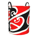 Red, black, and white patterned bag with handles on a white background