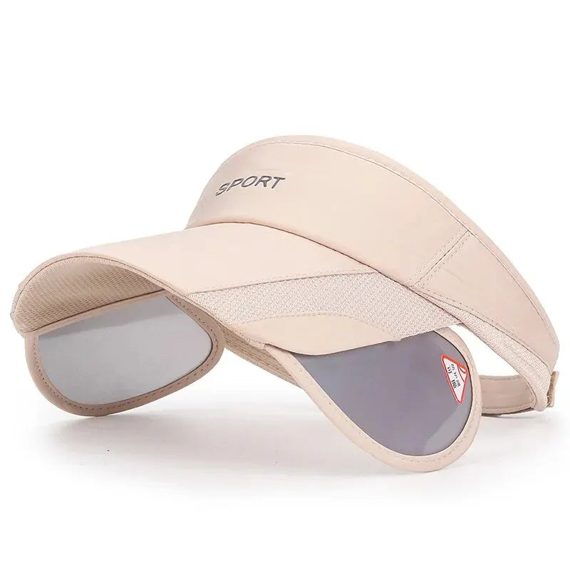 Beige visor cap with sunglasses attached on a white background