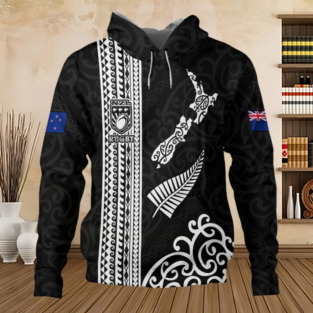 Black hoodie with white patterns and designs on a wooden floor.