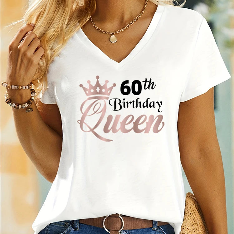 White t-shirt with '60th Birthday Queen' text and crown design on a blurred background