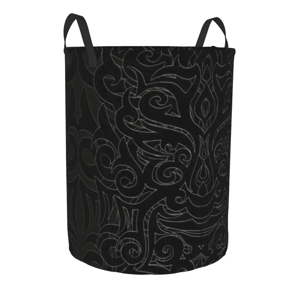 Black laundry basket with intricate white patterns on a white background
