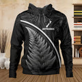 Black hoodie with silver fern design and 'Aotearoa' text in a room setting