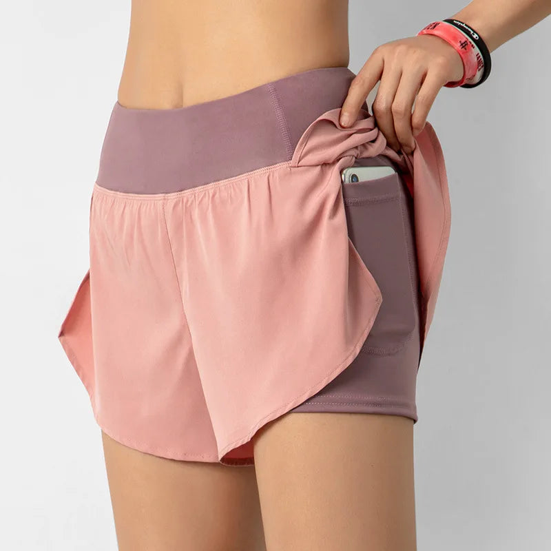 Pink and purple athletic skirt with a pocket on a gray background