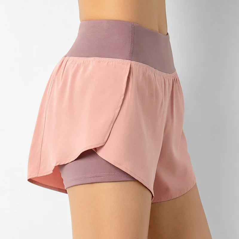 Two-layered skirt with pink top layer and purple bottom layer on a neutral background