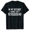 Black t-shirt with white text 'IN MY DEFENSE I WAS LEFT UNSUPERVISED' on a white background
