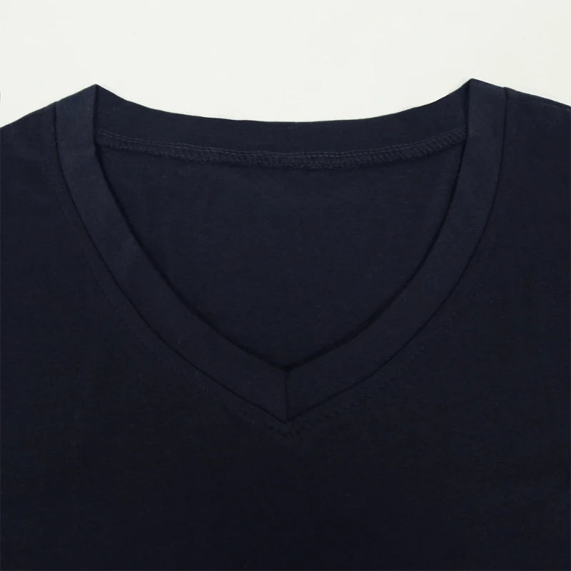 Close-up of a black V-neck t-shirt collar on a light gray background