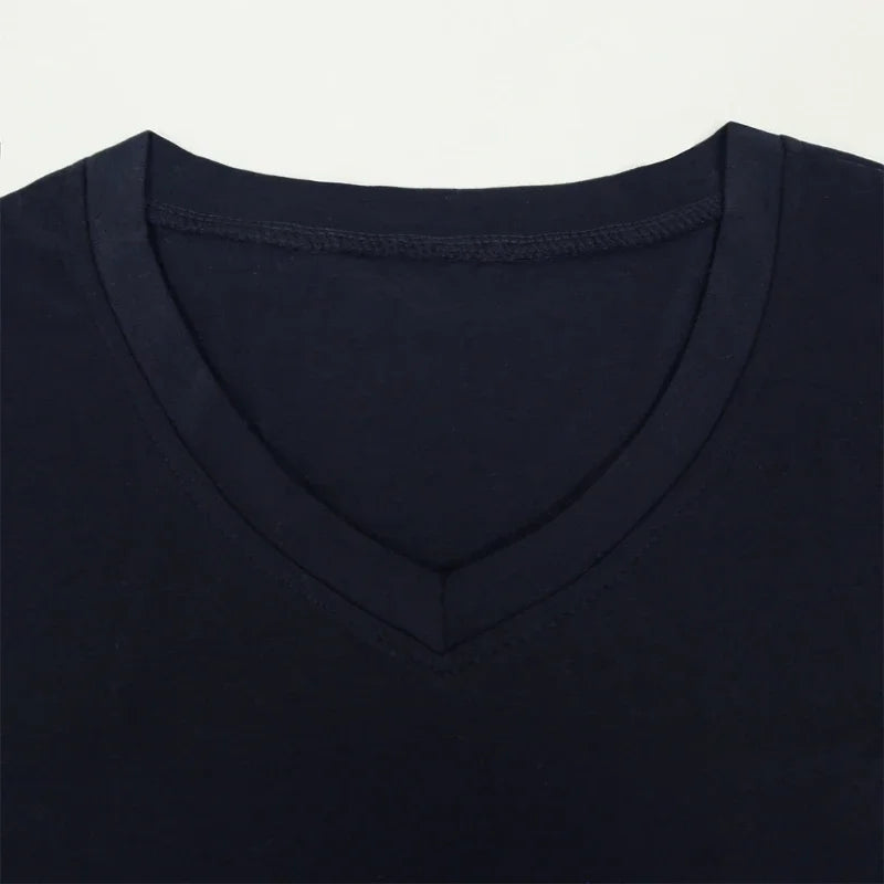 Close-up of a black V-neck shirt on a light gray background