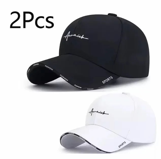 Two black and white baseball caps with branding on a white background