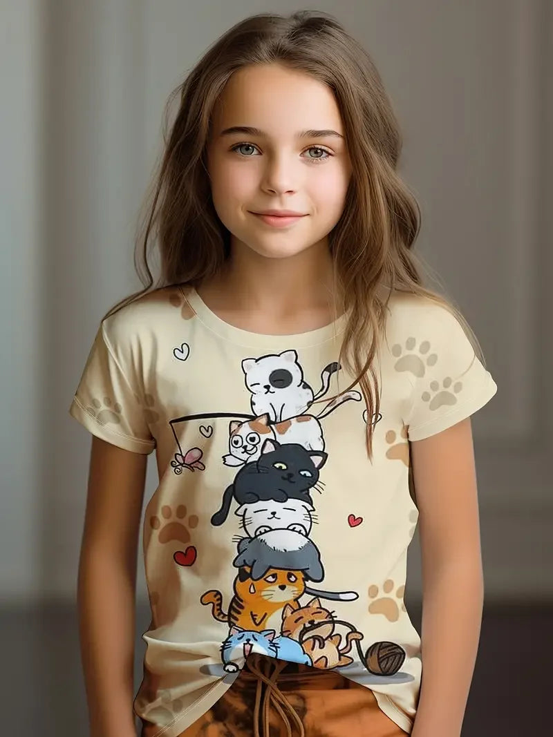 Young girl wearing a t-shirt with cartoon cat designs on a plain background