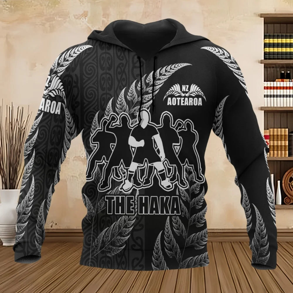 Black hoodie with white designs and text on a wooden floor