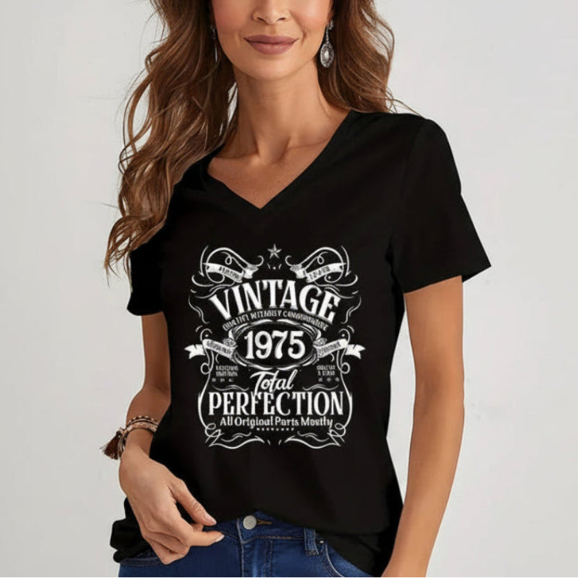 Woman wearing a black t-shirt with vintage design 1975 text