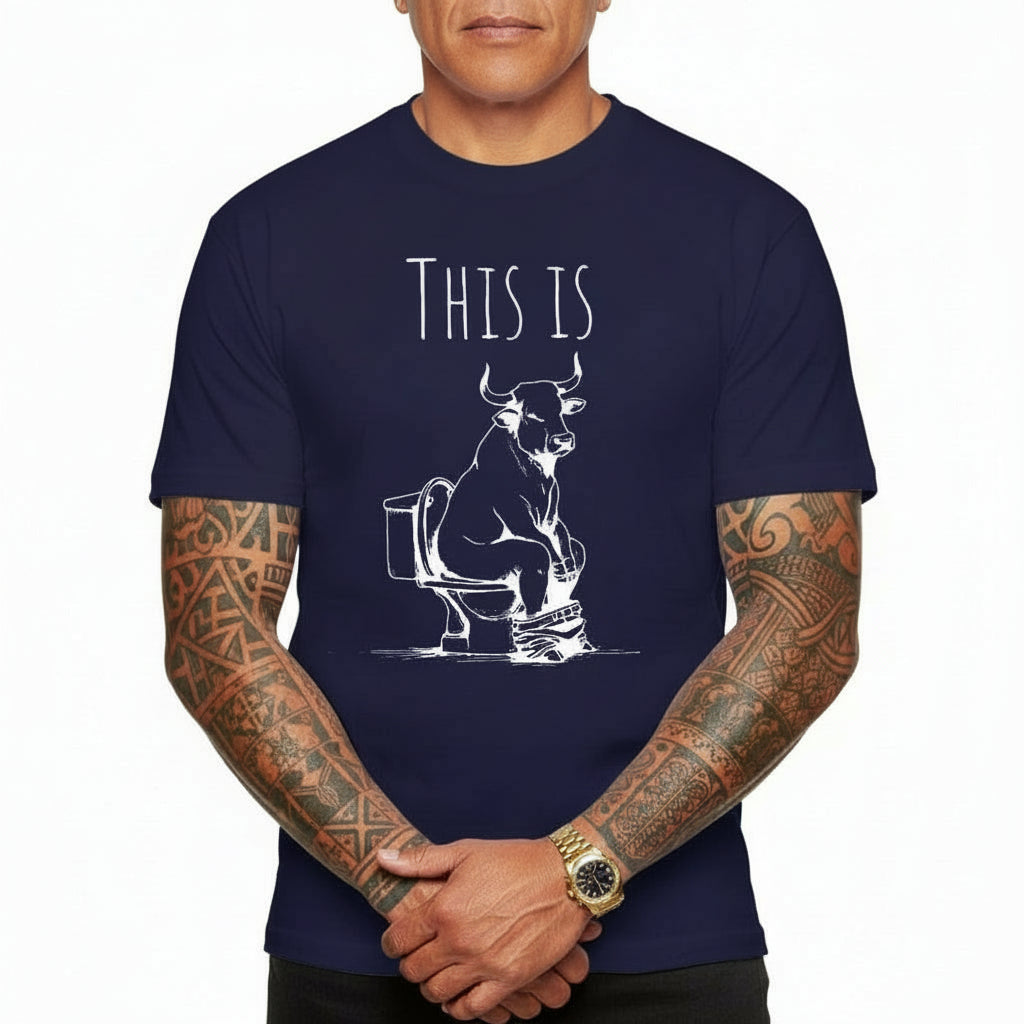 Navy blue t-shirt with a graphic of a bull on a toilet and text 'THIS IS' worn by a person.